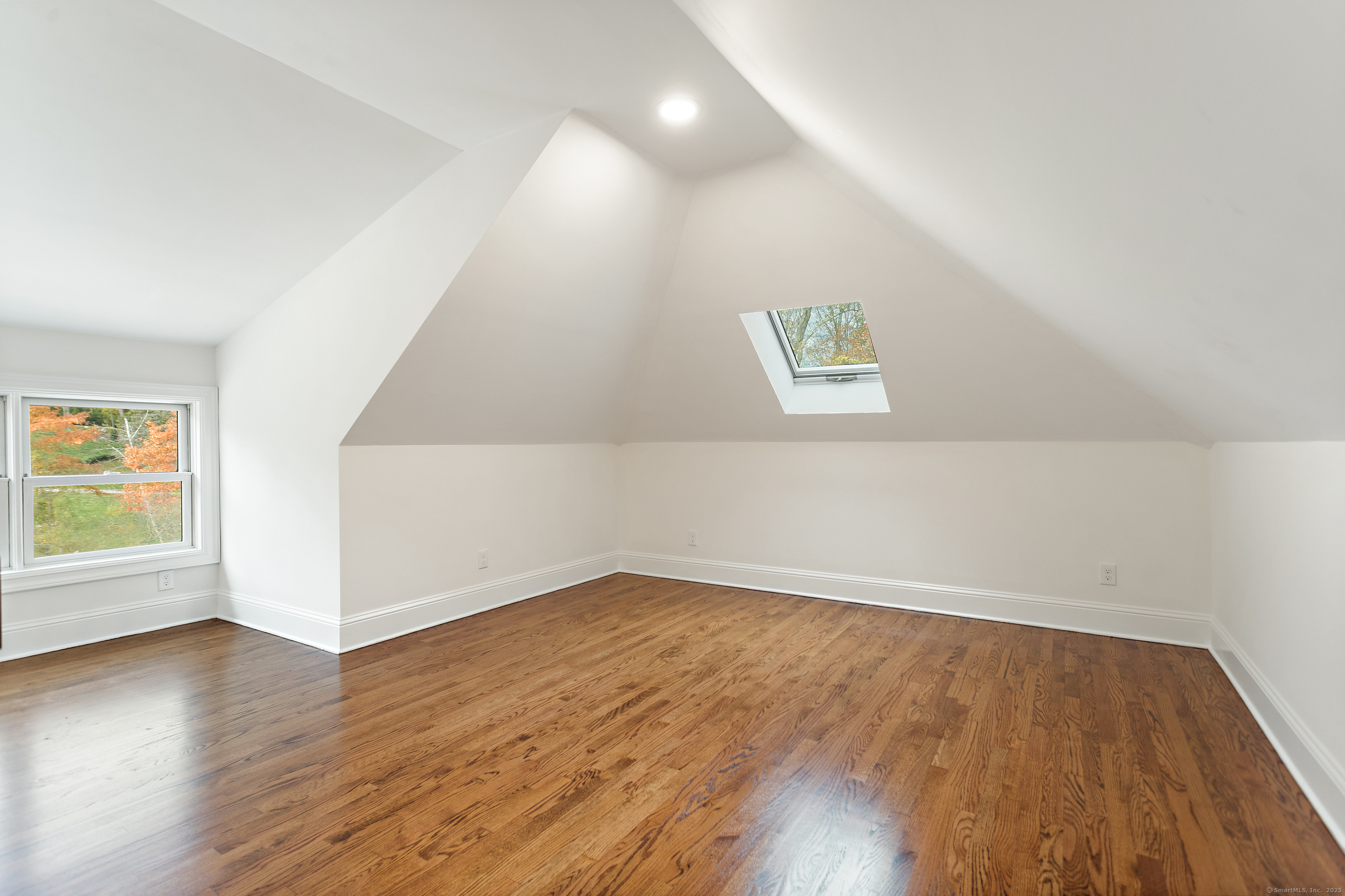 123 Greens Farms Road Westport, CT 06880 - Photo 33 of 40 an empty room with wooden floor and windows