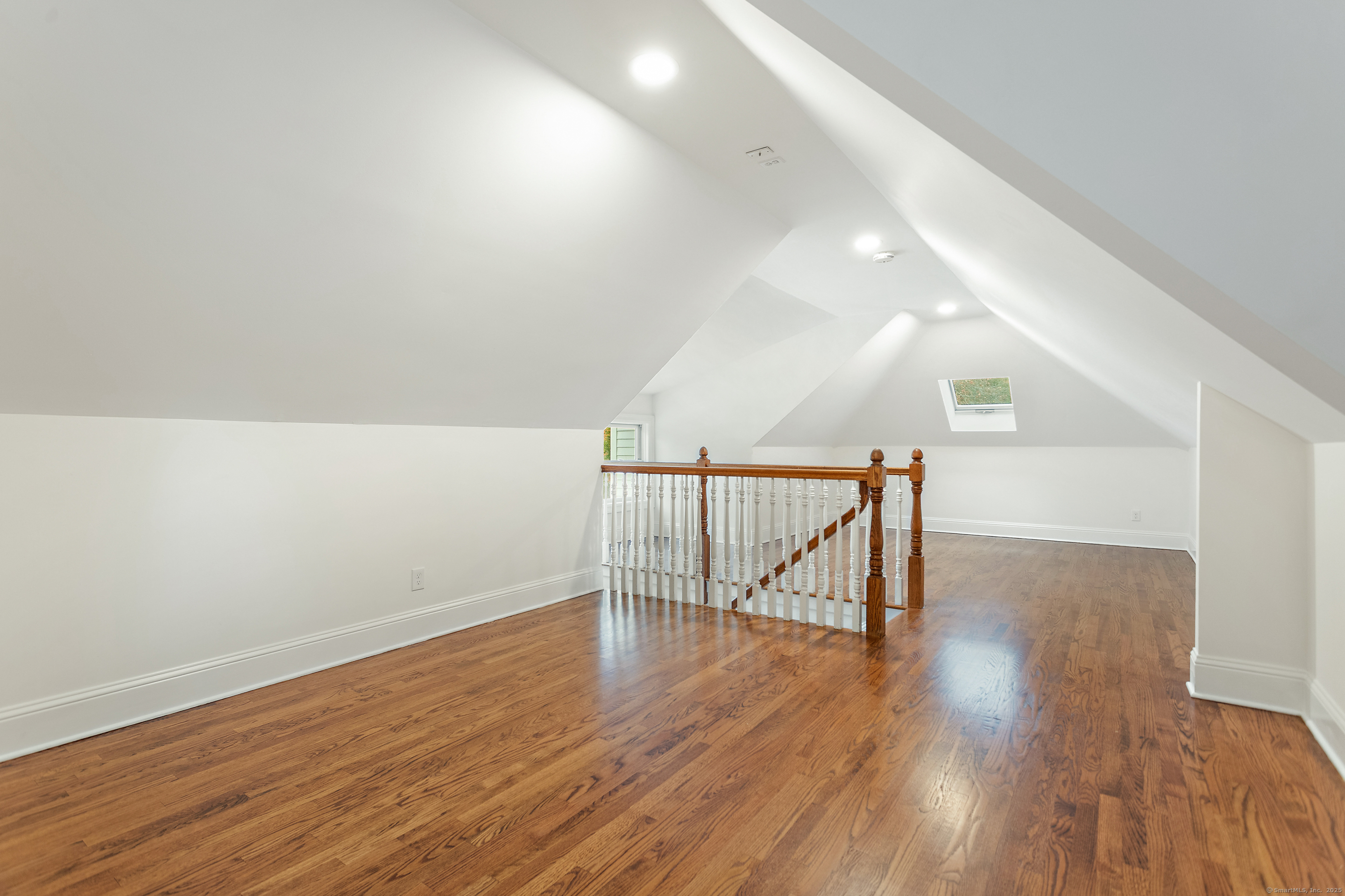 123 Greens Farms Road Westport, CT 06880 - Photo 34 of 40 a view of an empty room with wooden floor