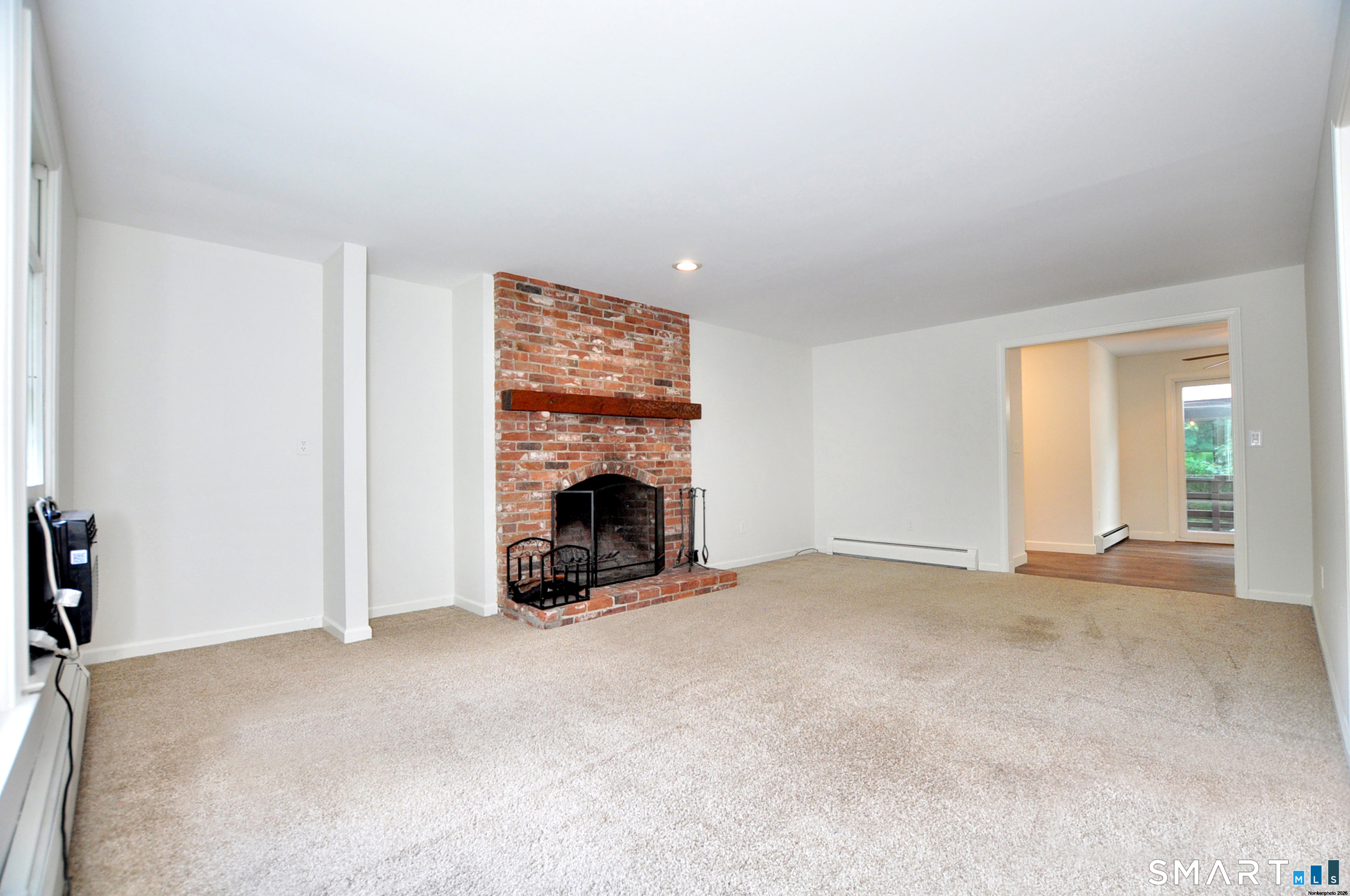 117 Hollow Brook Road Windsor, CT 06095 - Photo 19 of 40 Family room with fireplace