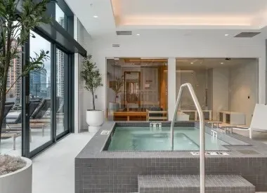 a swimming pool with outdoor seating and yard