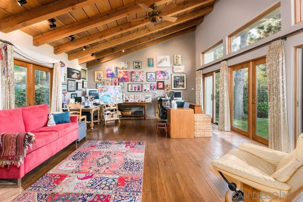 16722 Via Lago Azul Rancho Santa Fe, CA 92067 - Photo 11 of 20 a living room with furniture fireplace and a table