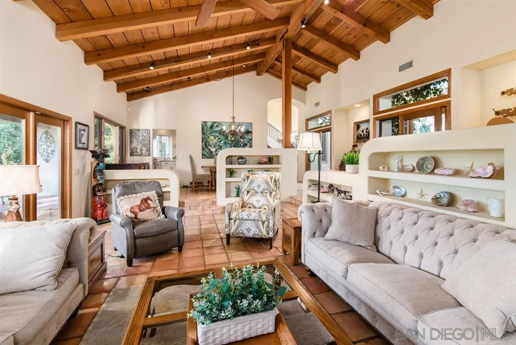 16722 Via Lago Azul Rancho Santa Fe, CA 92067 - Photo 6 of 20 a living room with furniture and a chandelier