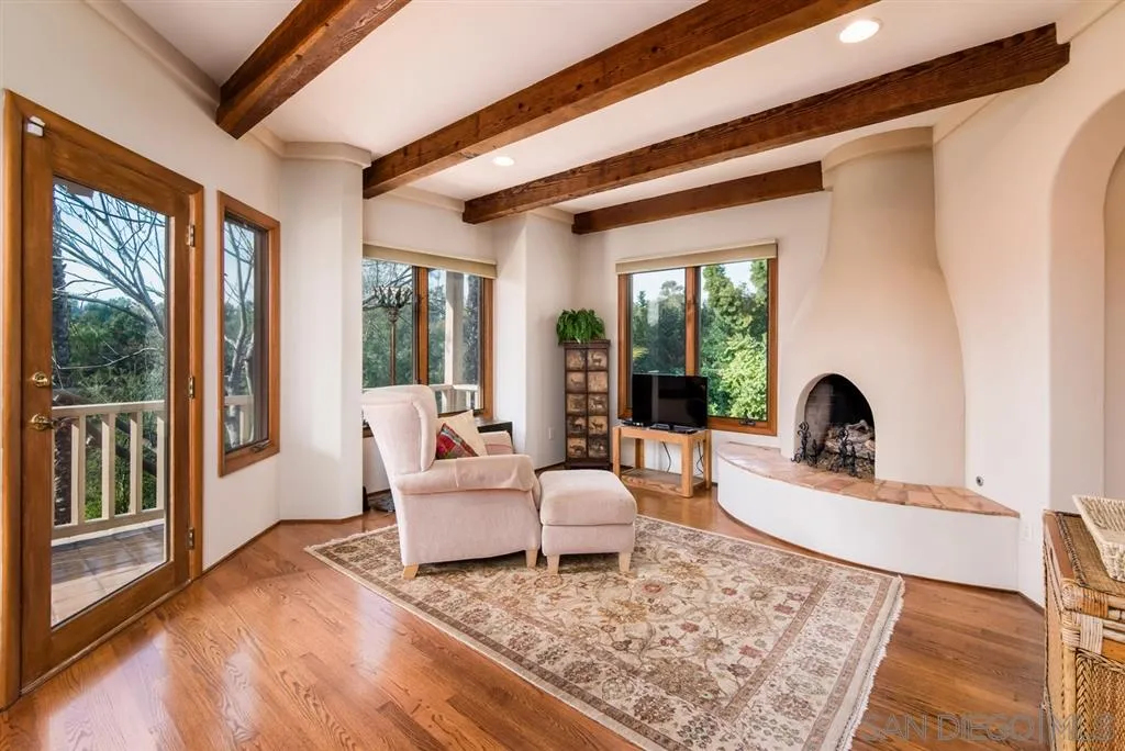 16722 Via Lago Azul Rancho Santa Fe, CA 92067 - Photo 7 of 20 a living room with furniture large window and rug
