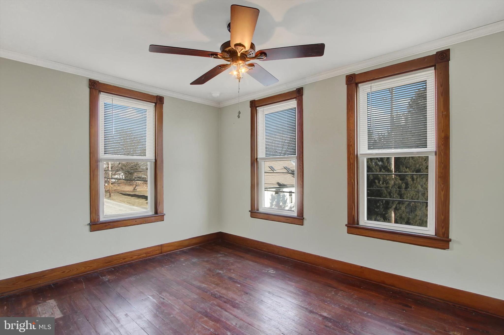 367 High Street Orrtanna, PA 17353 - Photo 21 of 26 a view of an empty room with a window and wooden floor