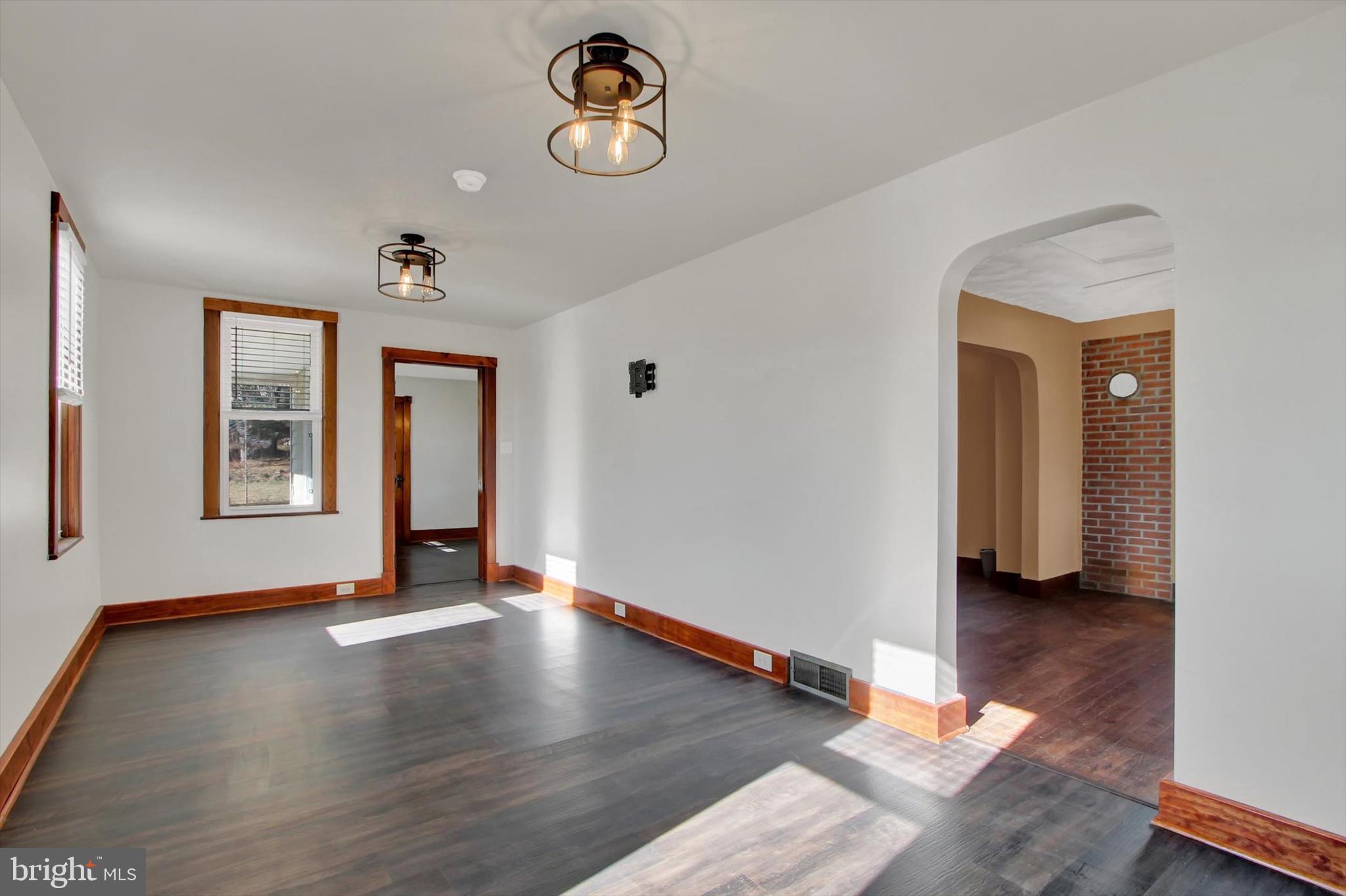 367 High Street Orrtanna, PA 17353 - Photo 10 of 26 a view of an empty room with window and wooden floor