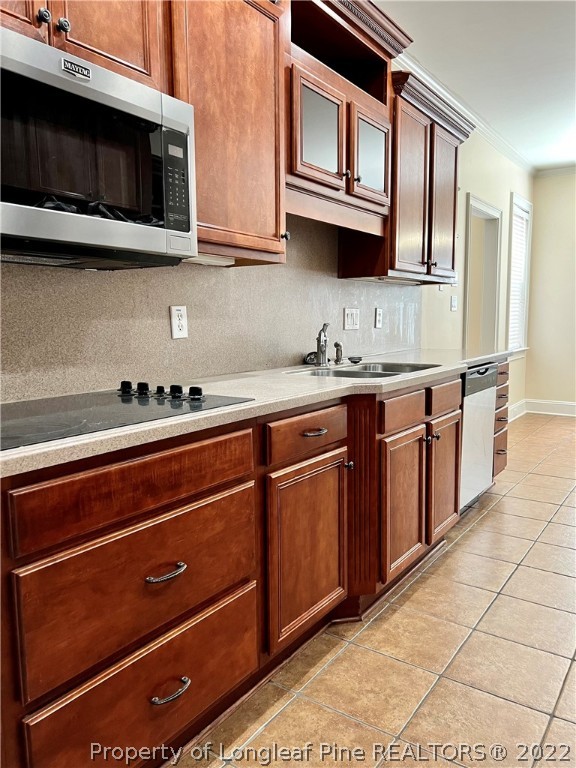 2633 Plum Ridge Road Fayetteville, NC 28306 - Photo 11 of 50 a kitchen with stainless steel appliances granite countertop a sink and a microwave