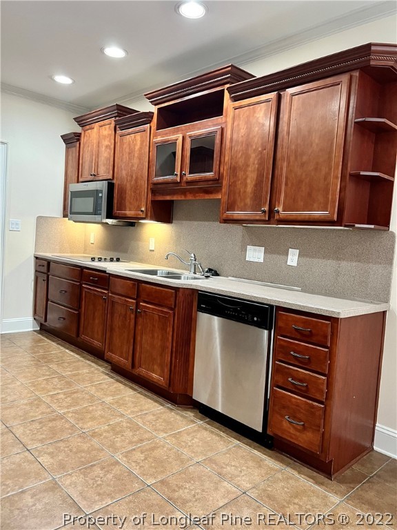 2633 Plum Ridge Road Fayetteville, NC 28306 - Photo 13 of 50 a kitchen with stainless steel appliances granite countertop a stove a sink and a microwave