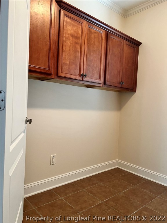 2633 Plum Ridge Road Fayetteville, NC 28306 - Photo 16 of 50 a view of a room with wooden floor and cabinet