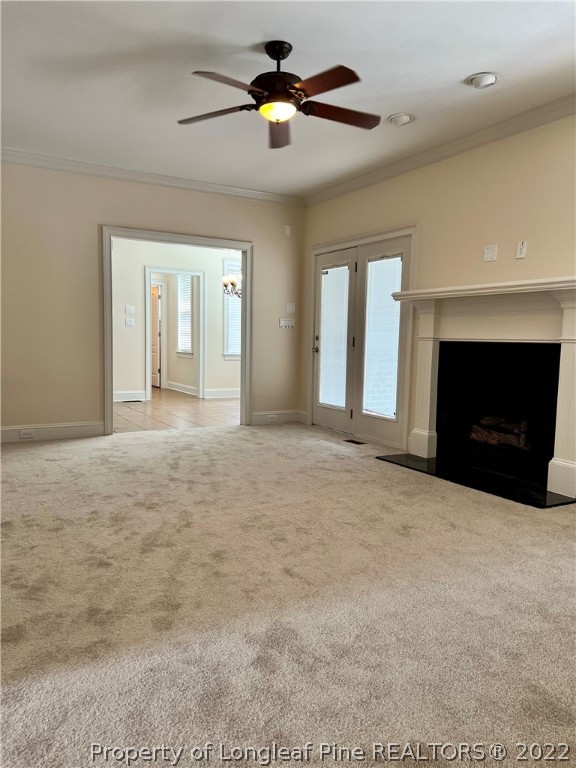 2633 Plum Ridge Road Fayetteville, NC 28306 - Photo 20 of 50 a view of an empty room with chandelier fan and fire place