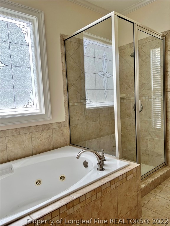 2633 Plum Ridge Road Fayetteville, NC 28306 - Photo 28 of 50 a bathroom with a tub and a shower