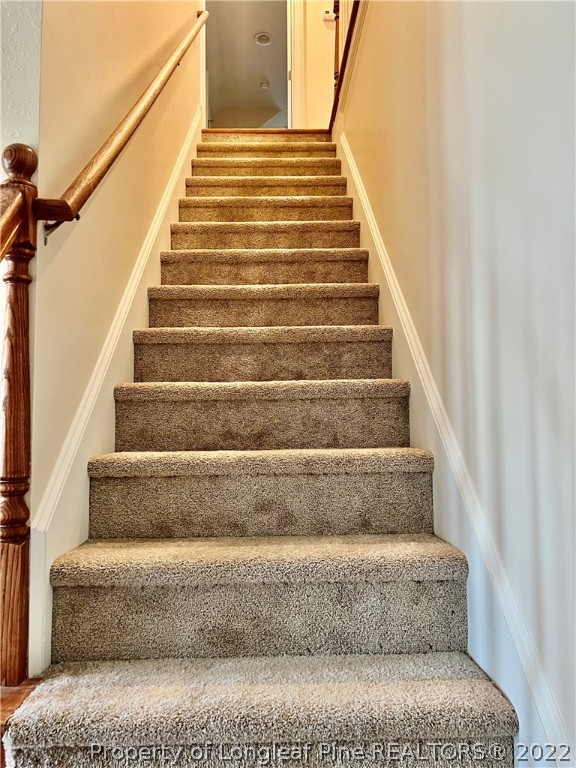 2633 Plum Ridge Road Fayetteville, NC 28306 - Photo 30 of 50 a view of staircase with white walls