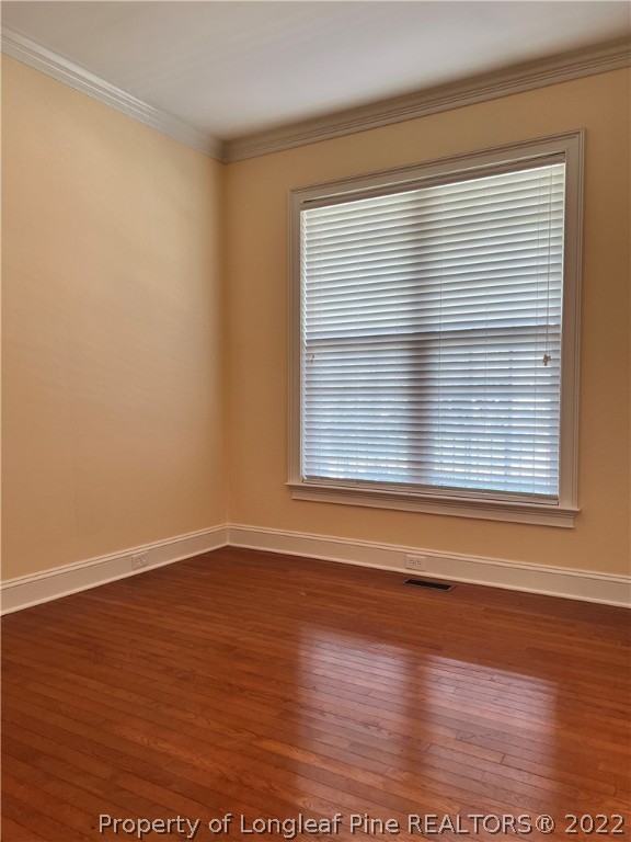 2633 Plum Ridge Road Fayetteville, NC 28306 - Photo 4 of 50 a view of empty room with wooden floor and fan