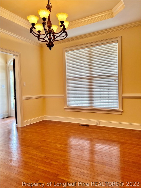 2633 Plum Ridge Road Fayetteville, NC 28306 - Photo 7 of 50 a view of a room with wooden floor and a window