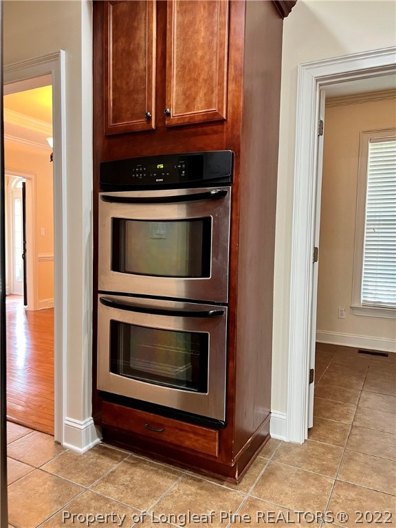 2633 Plum Ridge Road Fayetteville, NC 28306 - Photo 9 of 50 a stove top oven sitting inside of a kitchen