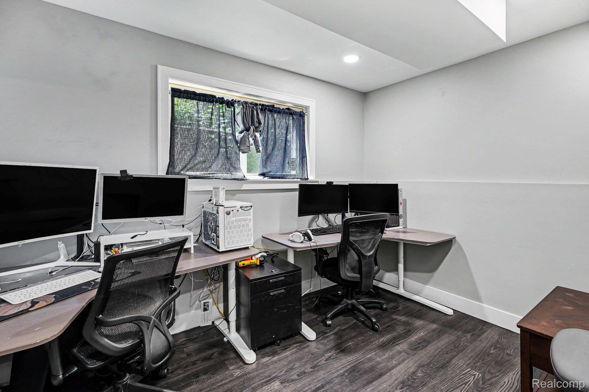 30831 Ridgefield Avenue Warren, MI 48088 - Photo 12 of 17 Dedicated workspace featuring wood-finish flooring, light grey painted walls, a window with white trim, and recessed ceiling lighting