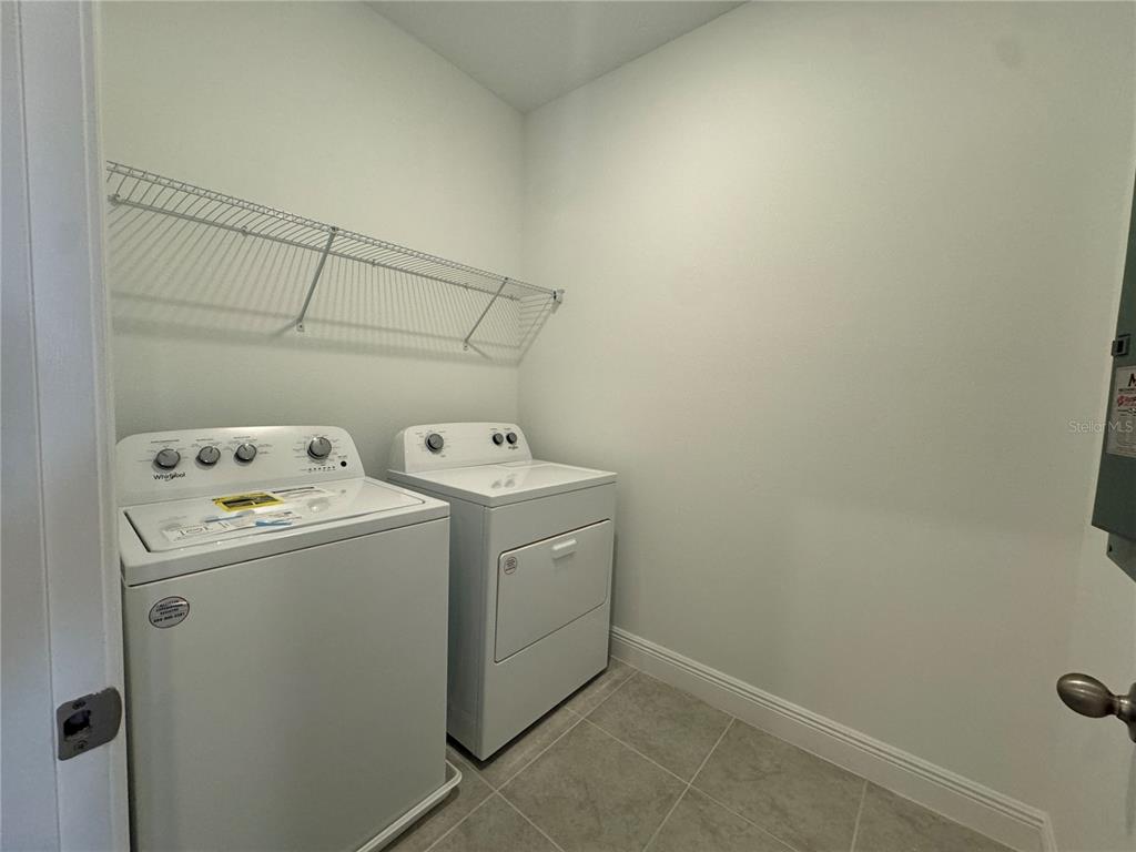 16333 Hamlin Hills Road Winter Garden, FL 34787 - Photo 18 of 35 a utility room with dryer and washer