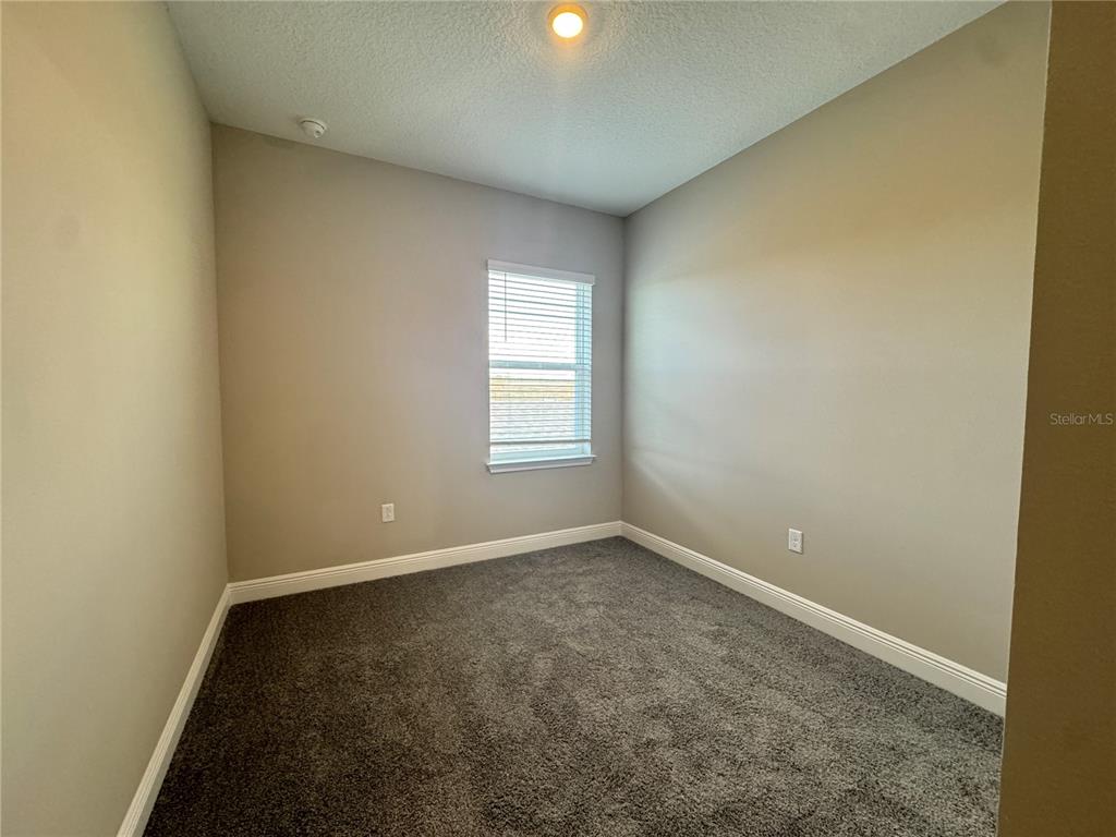 16333 Hamlin Hills Road Winter Garden, FL 34787 - Photo 19 of 35 an empty room with windows