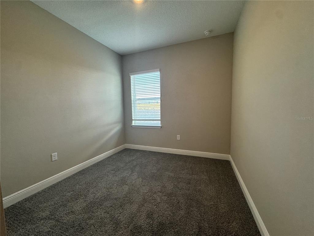 16333 Hamlin Hills Road Winter Garden, FL 34787 - Photo 21 of 35 an empty room with a window