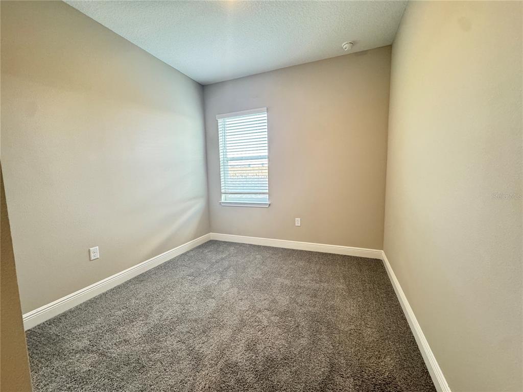 16333 Hamlin Hills Road Winter Garden, FL 34787 - Photo 22 of 35 an empty room with a window
