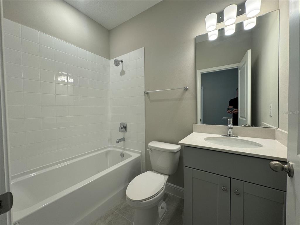 16333 Hamlin Hills Road Winter Garden, FL 34787 - Photo 24 of 35 a bathroom with a sink toilet vanity and shower