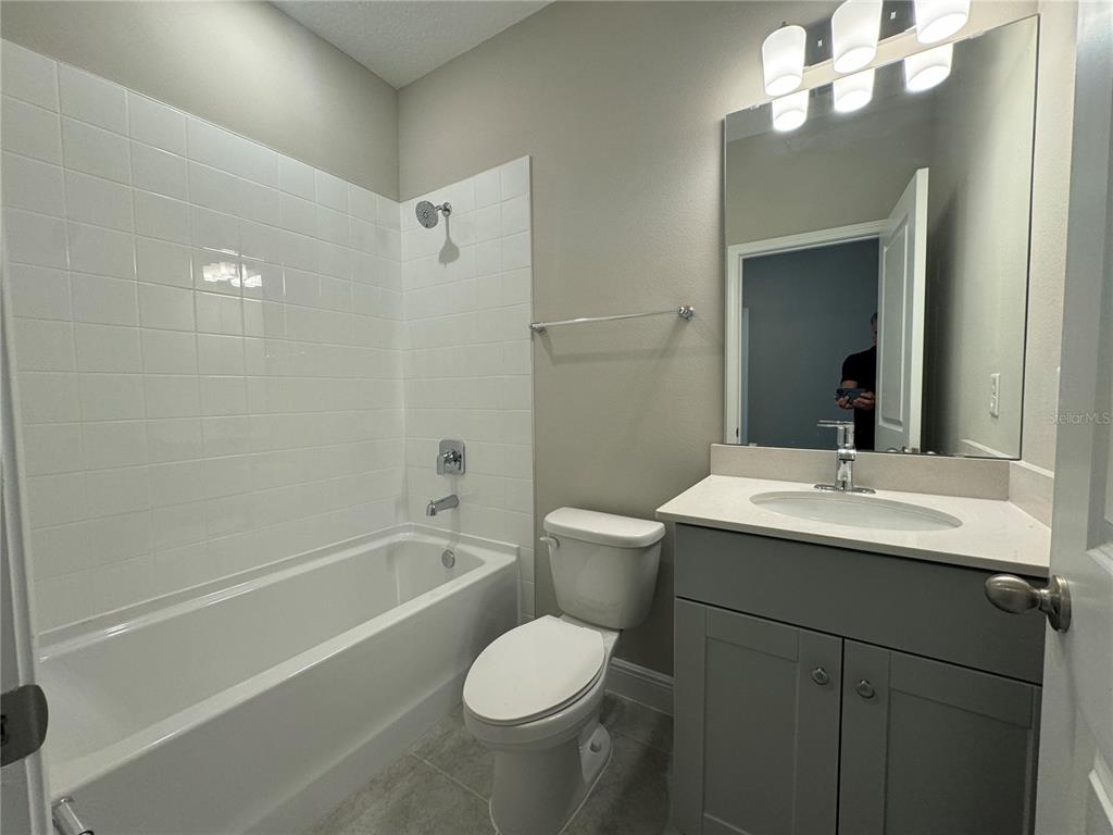 16333 Hamlin Hills Road Winter Garden, FL 34787 - Photo 25 of 35 a bathroom with a sink toilet and shower