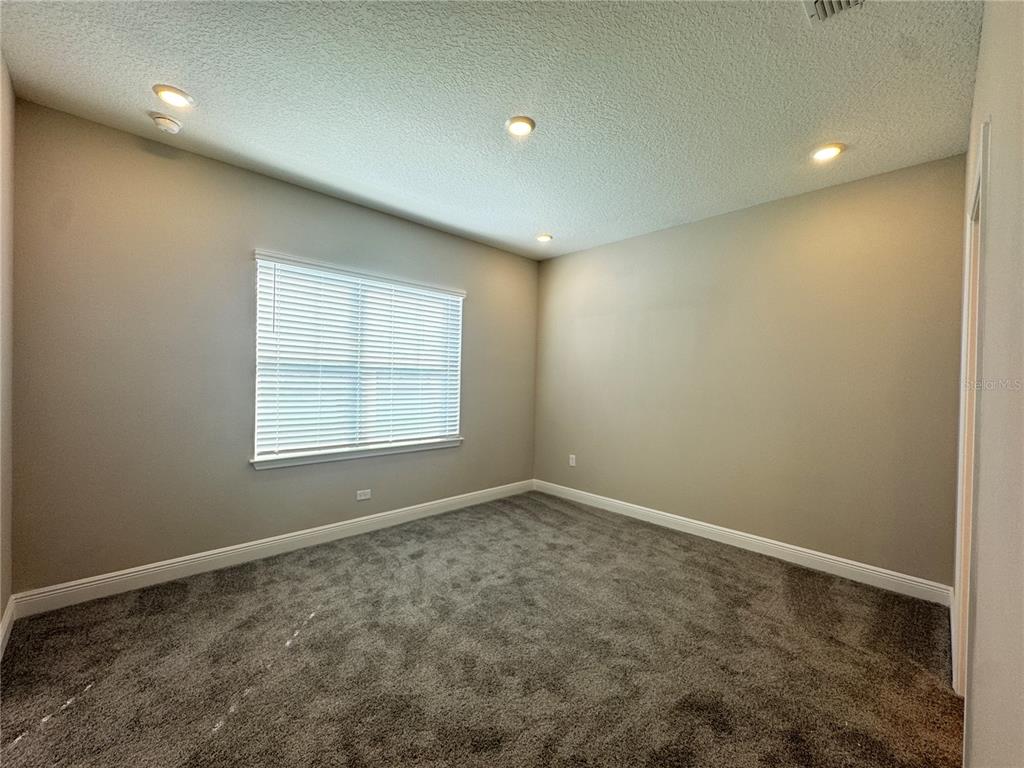 16333 Hamlin Hills Road Winter Garden, FL 34787 - Photo 27 of 35 an empty room with windows