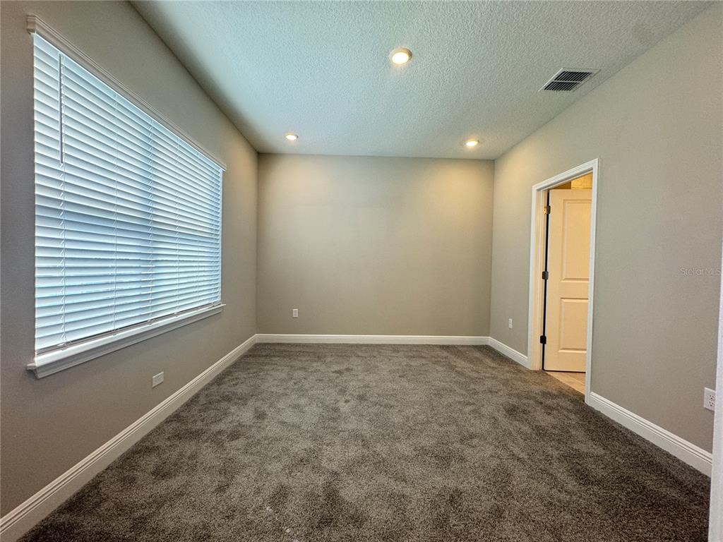 16333 Hamlin Hills Road Winter Garden, FL 34787 - Photo 29 of 35 a view of an empty room with a window