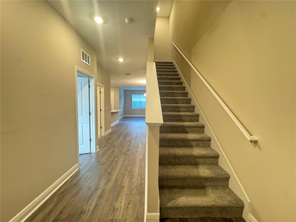 16333 Hamlin Hills Road Winter Garden, FL 34787 - Photo 3 of 35 a view of entryway and hall with wooden floor