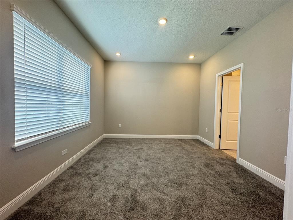 16333 Hamlin Hills Road Winter Garden, FL 34787 - Photo 31 of 35 a view of an empty room with a window