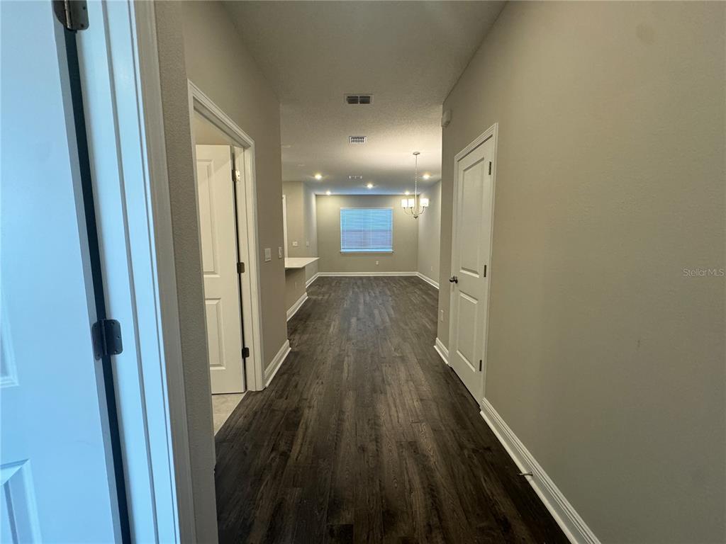 16333 Hamlin Hills Road Winter Garden, FL 34787 - Photo 7 of 35 a view of gallery with wooden floor