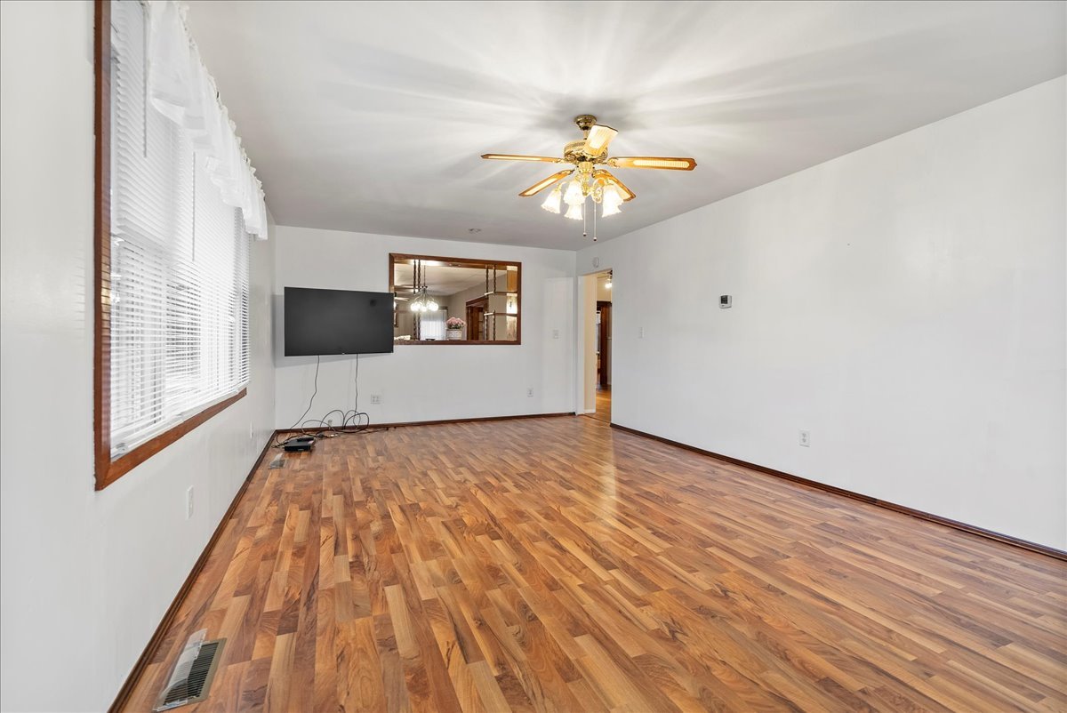 112 East Jefferson Street Dana, IL 61321 - Photo 24 of 40 wooden floor in an empty room with a window
