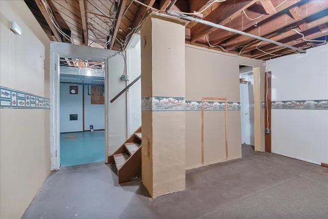 a view of a hallway with stairs