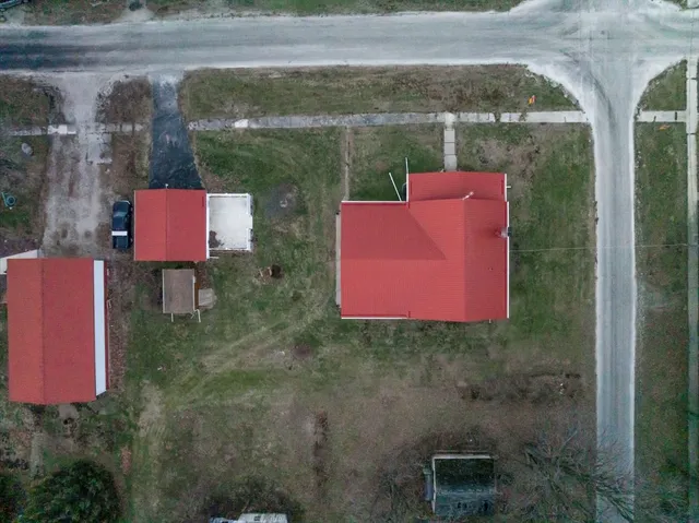 a view of a wooden fence next to a yard