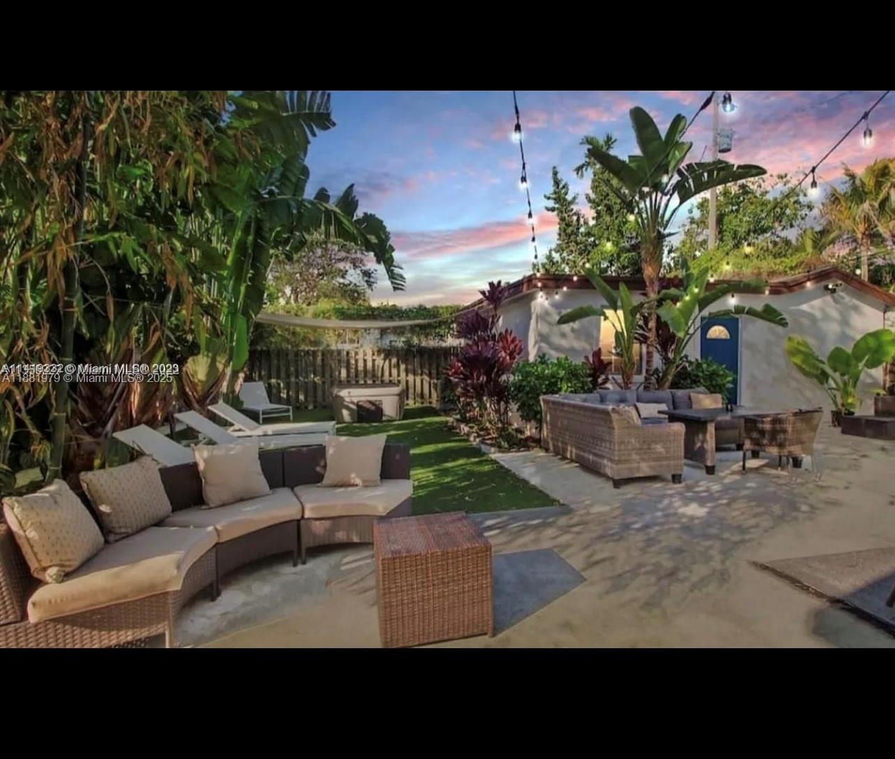 149 Northwest 48th Street Miami, FL 33127 - Photo 17 of 24 a view of a backyard with couches and a fire pit