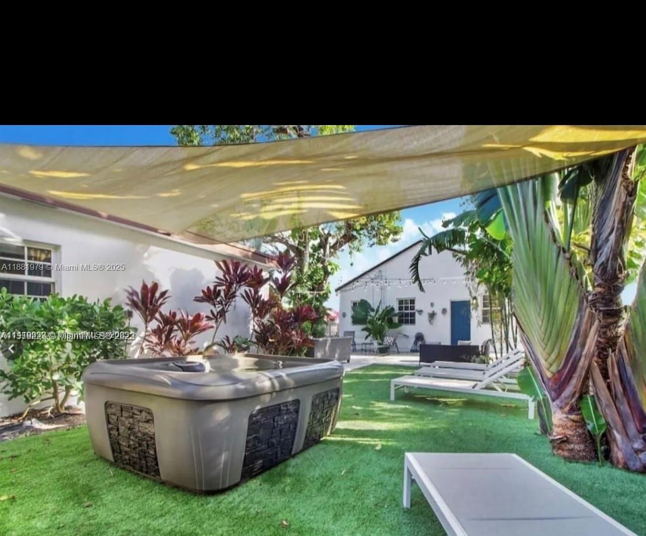 149 Northwest 48th Street Miami, FL 33127 - Photo 19 of 24 a view of a swimming pool with a patio