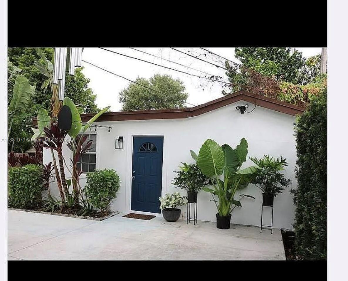 149 Northwest 48th Street Miami, FL 33127 - Photo 21 of 24 a view of a house with backyard and garden