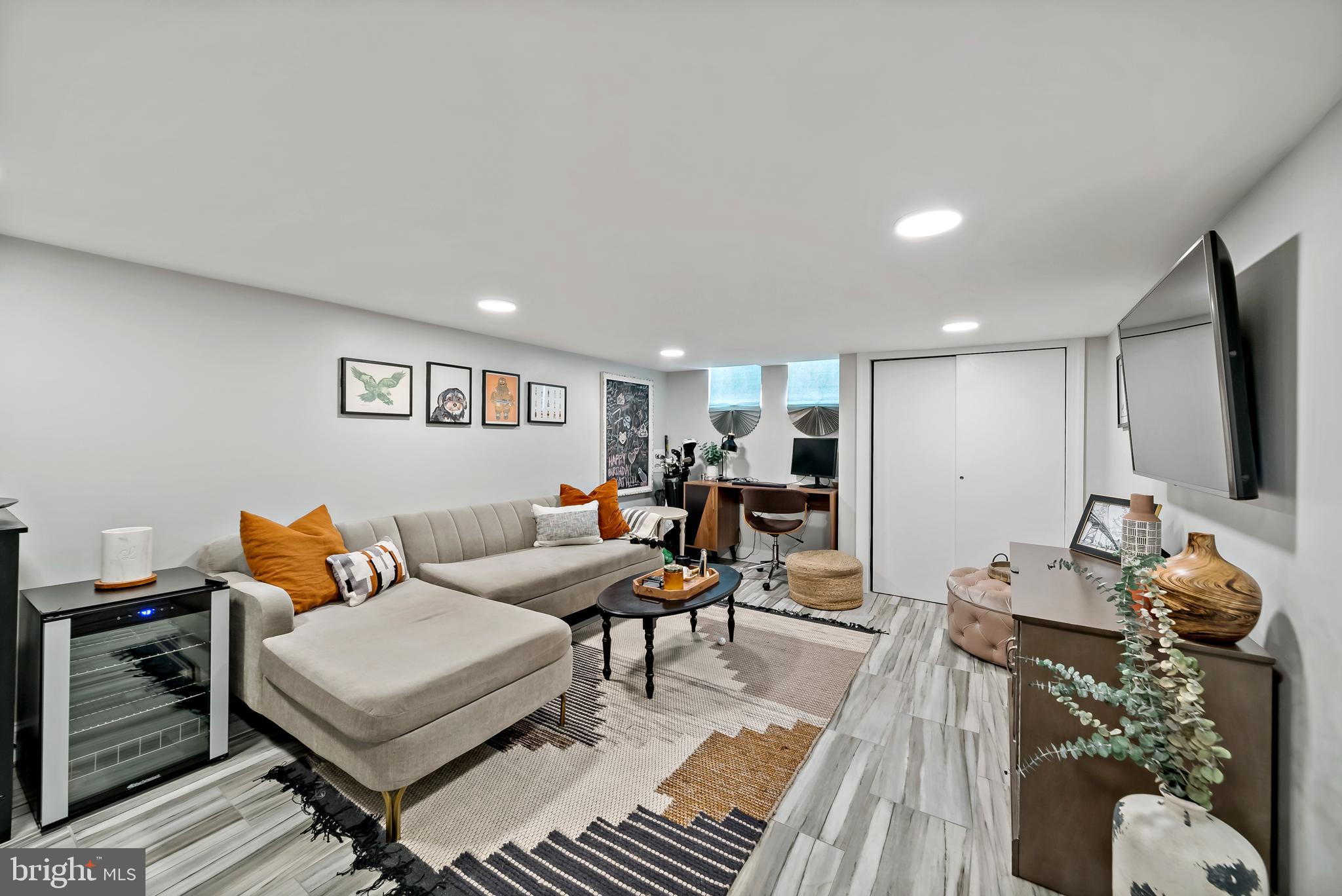 1225 Tree Street Philadelphia, PA 19148 - Photo 13 of 18 a living room with furniture a wooden floor and a sink