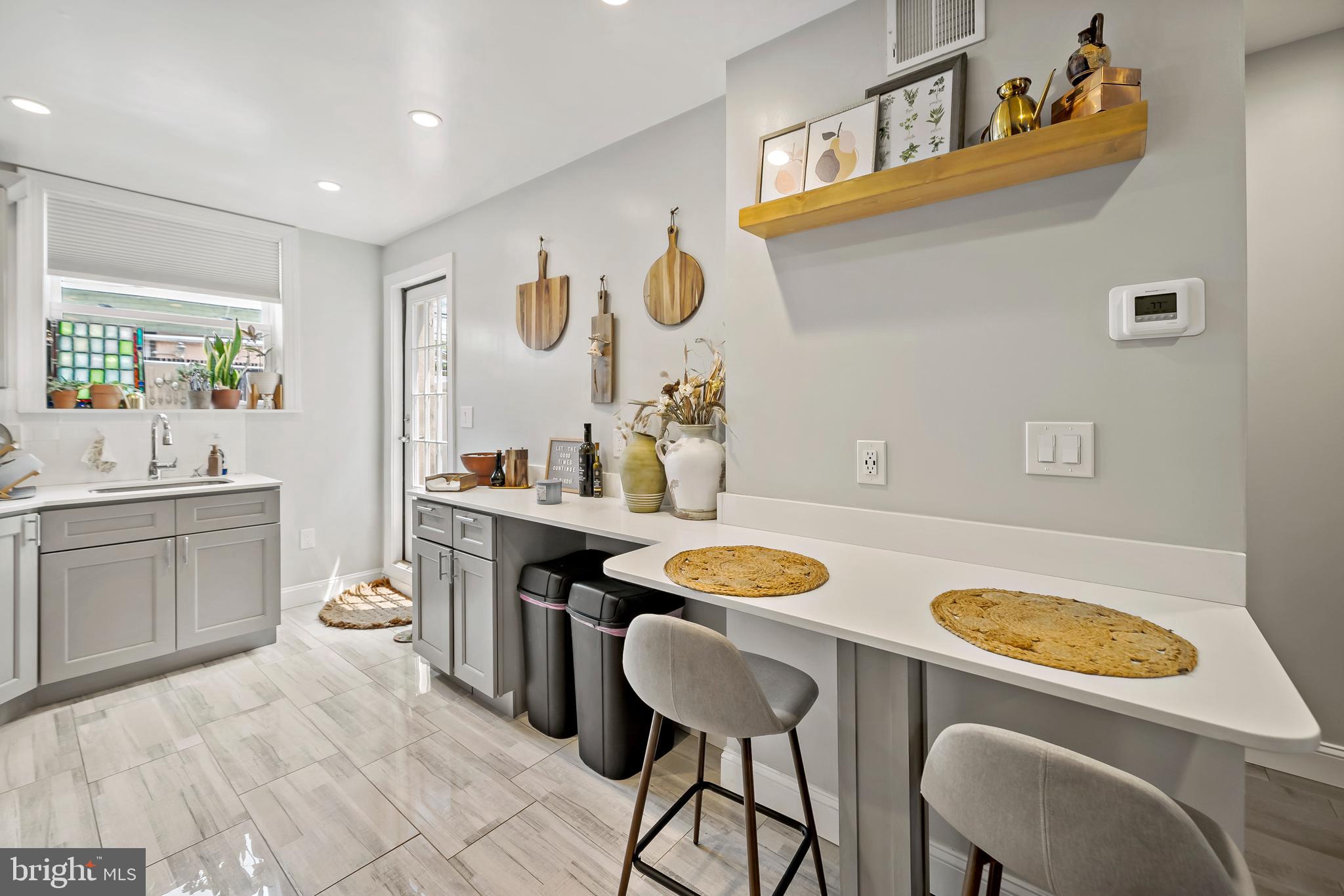 1225 Tree Street Philadelphia, PA 19148 - Photo 8 of 18 a kitchen with a table and chairs in it