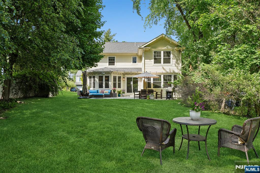 11 Mt Vernon Road Montclair, NJ 07043 - Photo 35 of 49 a view of a house with a yard table and chairs