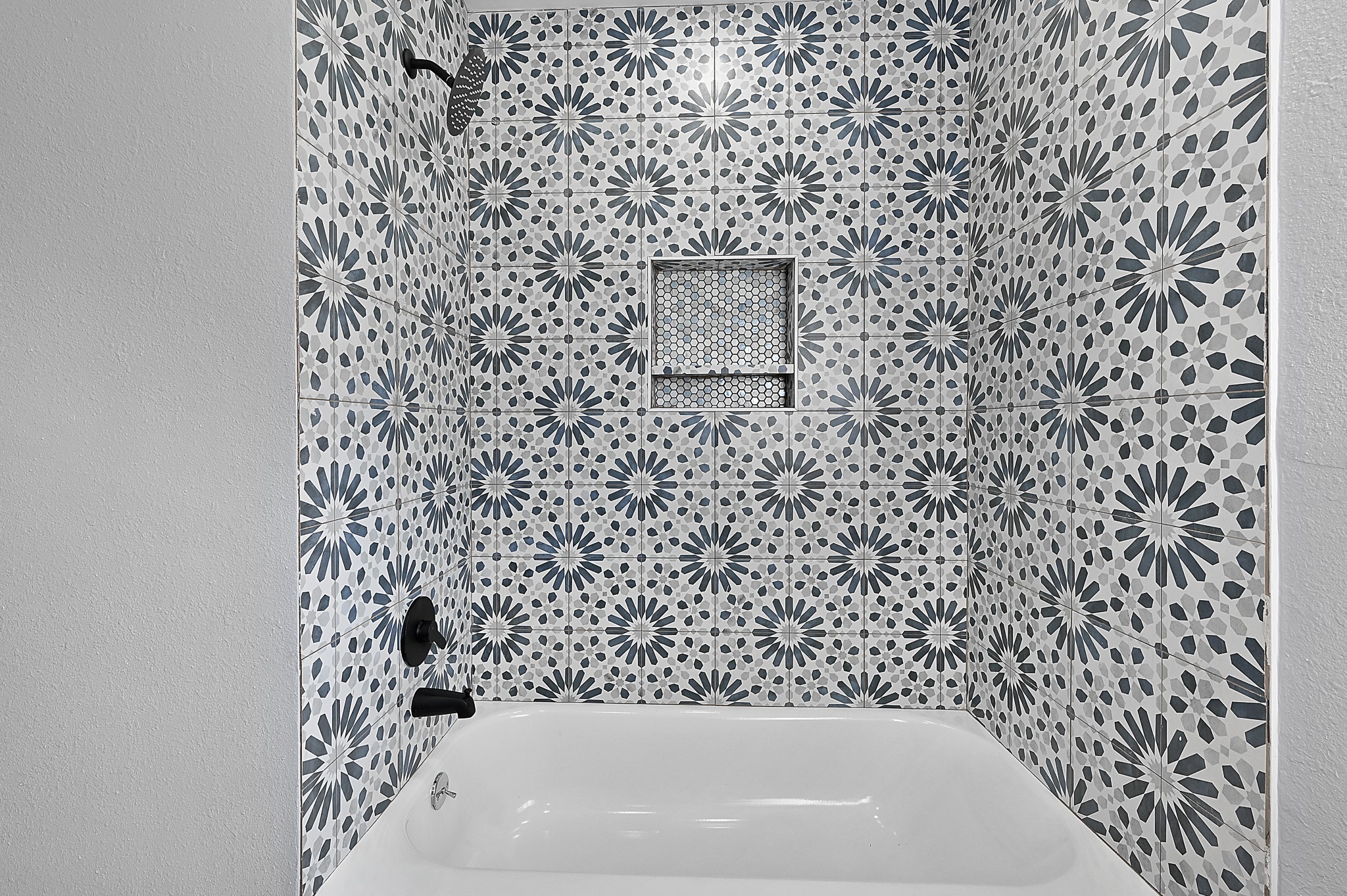 4406 Edison Street Houston, TX 77009 - Photo 12 of 42 a bathroom with a bathtub and a shower