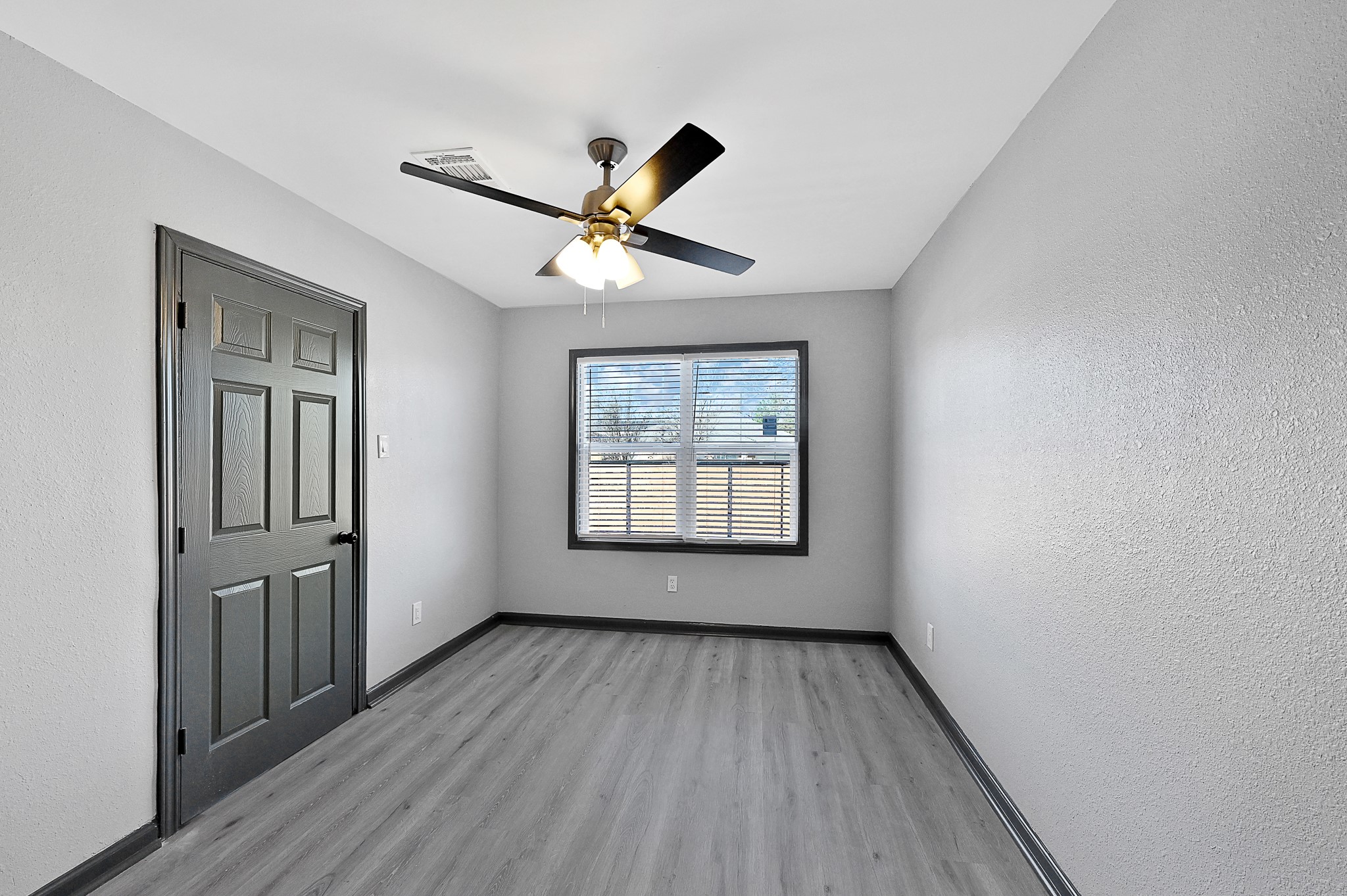 4406 Edison Street Houston, TX 77009 - Photo 15 of 42 wooden floor in an empty room with a window