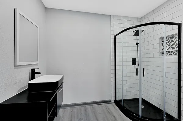 a bathroom with a sink and a mirror