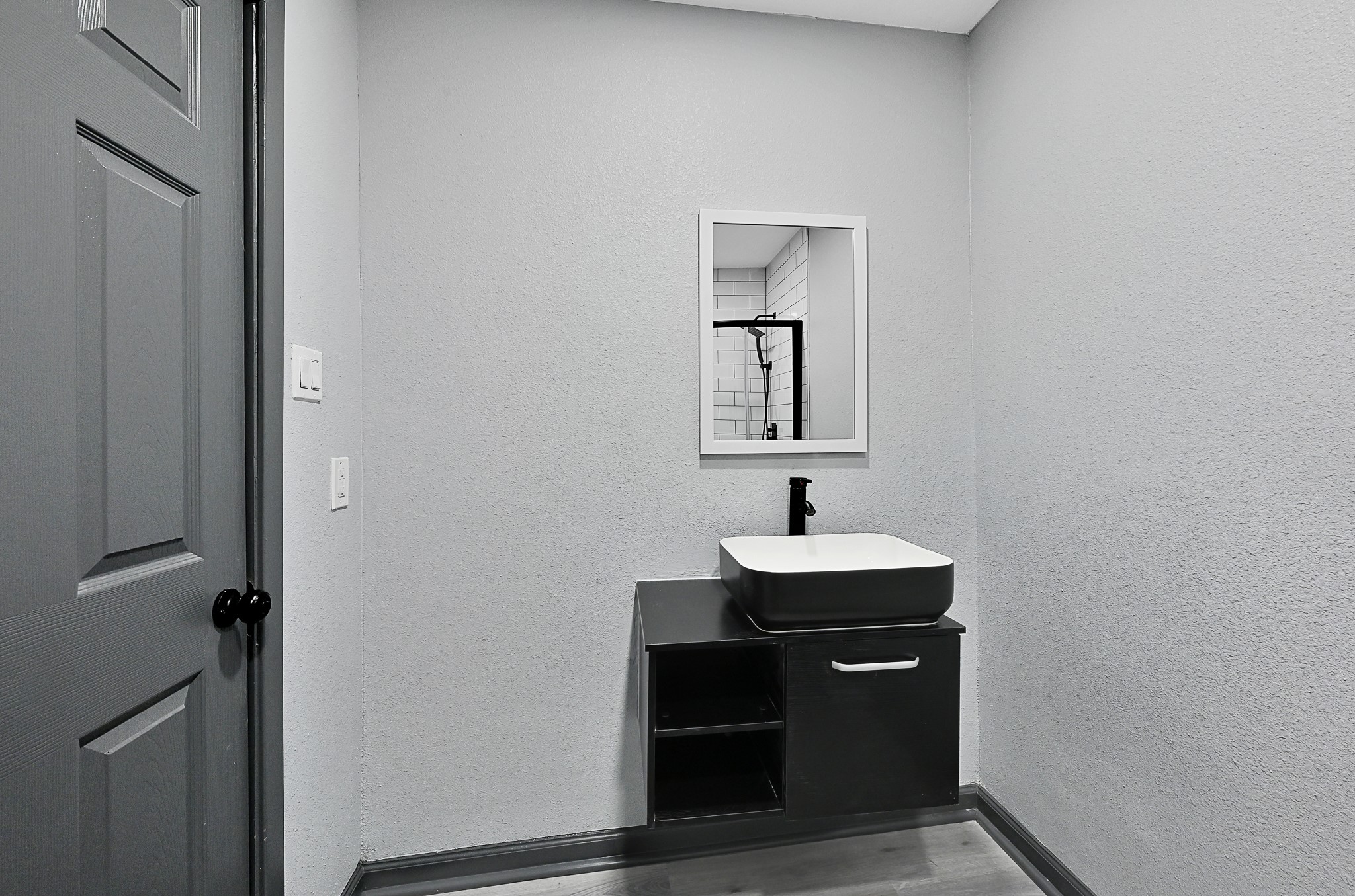 4406 Edison Street Houston, TX 77009 - Photo 18 of 42 a bathroom with a sink and a mirror