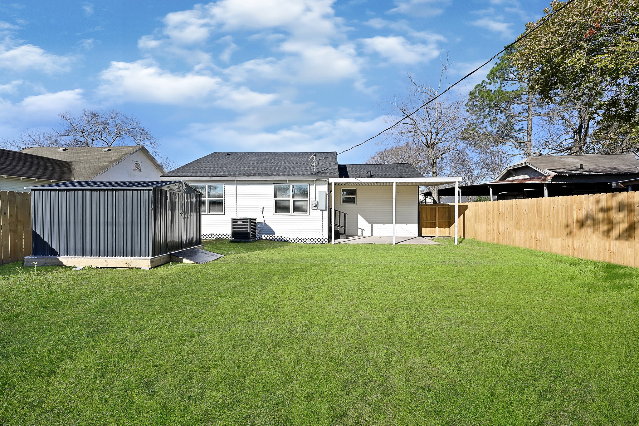 4406 Edison Street Houston, TX 77009 - Photo 19 of 42 a view of a house with backyard and porch