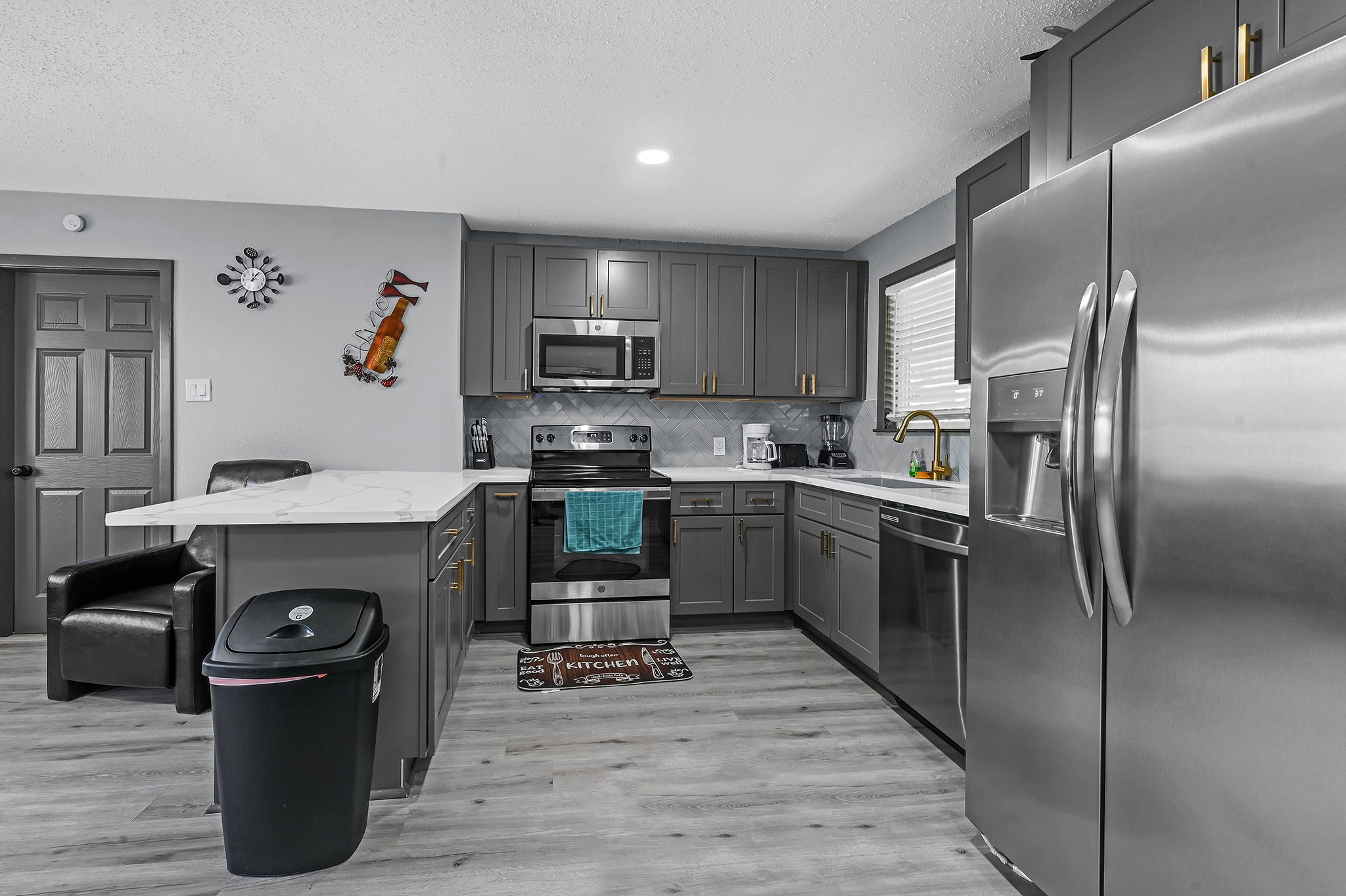 4406 Edison Street Houston, TX 77009 - Photo 26 of 42 a kitchen with granite countertop a refrigerator stove and sink