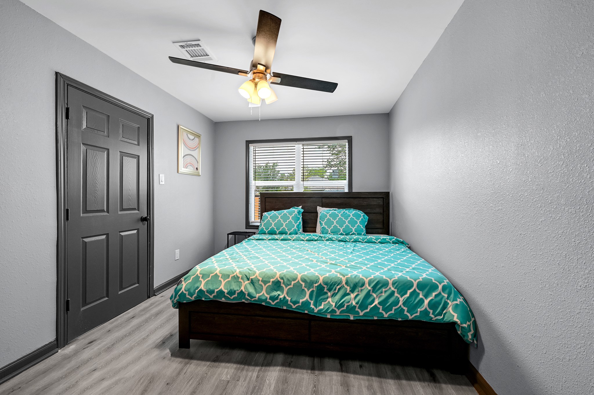 4406 Edison Street Houston, TX 77009 - Photo 29 of 42 a bedroom with a bed and a window