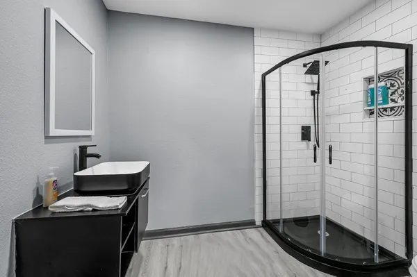 a bathroom with a sink and a mirror