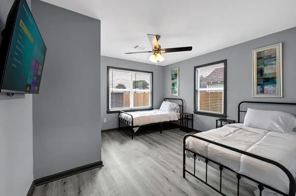 a bedroom with a bed and a couch