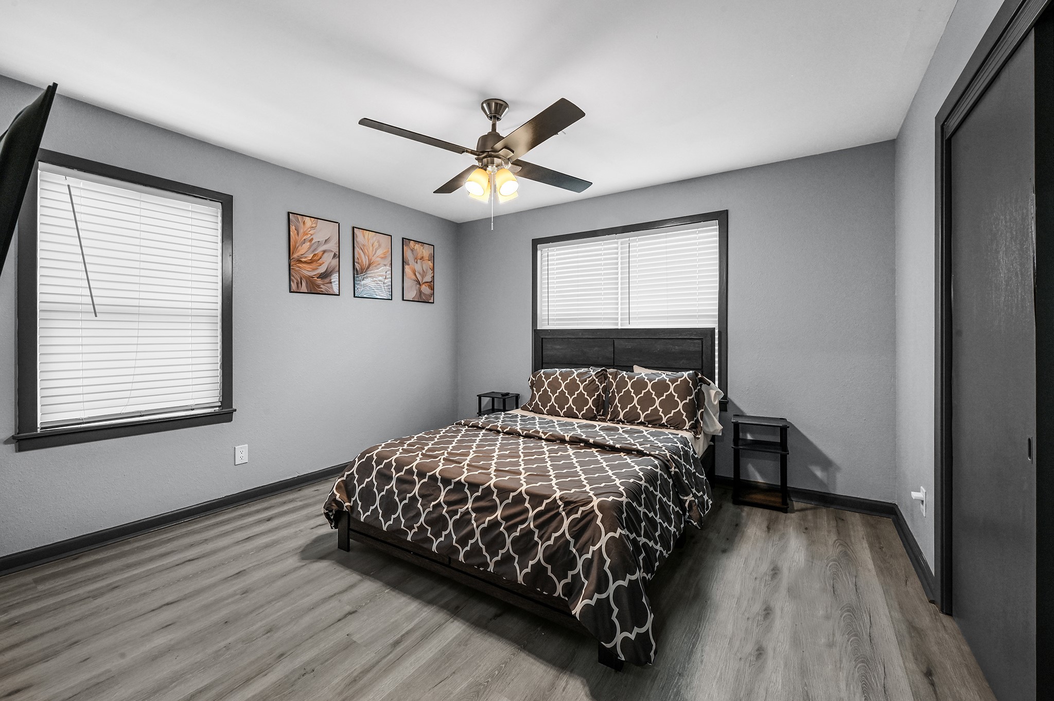 4406 Edison Street Houston, TX 77009 - Photo 37 of 42 a bedroom with a bed and wooden floor