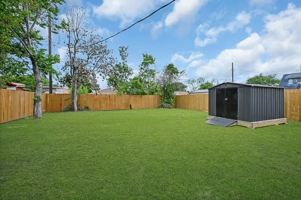 a backyard of a house with lots of green space